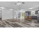 Open layout kitchen and living area with stainless steel appliances and access to backyard at 1202 Emory St, Oxford, GA 30054