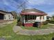 A small single Gathering home with red awning over the porch at 1243 Hill Nw St, Conyers, GA 30012