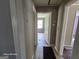 Hallway with tile floors and doorway openings to other rooms showcasing layout of home at 1243 Hill Nw St, Conyers, GA 30012