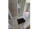 Tiled hallway featuring doorways to various rooms, including the bathroom with a tub at 1243 Hill Nw St, Conyers, GA 30012