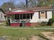 Exterior view of a one-story home featuring a porch and red awning at 1243 Hill Nw St, Conyers, GA 30012
