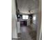 Spacious kitchen featuring tile flooring, cabinets, and a gas oven; in need of remodeling at 1243 Hill Nw St, Conyers, GA 30012