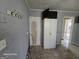 Spacious kitchen featuring a large storage cabinet with access to other rooms needing renovation at 1243 Hill Nw St, Conyers, GA 30012