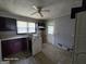 Image showcasing kitchen: cabinets, sink, stove, with damage and renovation needed at 1243 Hill Nw St, Conyers, GA 30012