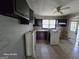 This kitchen has black and purple cabinetry, and is in need of renovation at 1243 Hill Nw St, Conyers, GA 30012