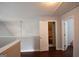 Lofted room with open closet and hardwood flooring at 75 Prestwick Ln, Peachtree City, GA 30269