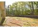 A wooden privacy fence surrounds the backyard space at 75 Prestwick Ln, Peachtree City, GA 30269