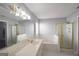 Bathroom features a gold trimmed shower stall, soaking tub, and a large mirror at 75 Prestwick Ln, Peachtree City, GA 30269
