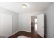 The bedroom has hardwood floors, a closet and a doorway to the hallway at 75 Prestwick Ln, Peachtree City, GA 30269