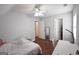 Bedroom featuring gray walls, ceiling fan, and access to a closet at 75 Prestwick Ln, Peachtree City, GA 30269