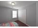 This bedroom has hardwood floors, a window, and a double-door closet at 75 Prestwick Ln, Peachtree City, GA 30269
