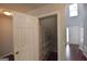Open closet with white wire shelves and a view of the entryway with staircase in the background at 75 Prestwick Ln, Peachtree City, GA 30269