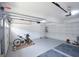 An organized garage with a garage door leading to the driveway at 75 Prestwick Ln, Peachtree City, GA 30269