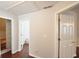 Upstairs hallway with access to multiple rooms, hardwood flooring at 75 Prestwick Ln, Peachtree City, GA 30269