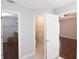 Hallway with white doors opening to a toilet, walk-in closet and main bedroom at 75 Prestwick Ln, Peachtree City, GA 30269