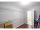 Walk-in closet with wire shelves and some cardboard moving boxes at 75 Prestwick Ln, Peachtree City, GA 30269