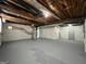 Spacious unfinished basement with painted walls, floor, and overhead ductwork at 1397 Iron Gate Blvd, Jonesboro, GA 30238