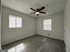 Bedroom features neutral paint, gray floors, and natural lighting at 1397 Iron Gate Blvd, Jonesboro, GA 30238