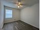 This bedroom has a window and wood-look flooring at 1397 Iron Gate Blvd, Jonesboro, GA 30238