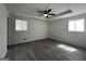 Bedroom features gray flooring, neutral paint, and recessed ceiling at 1397 Iron Gate Blvd, Jonesboro, GA 30238