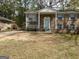 Charming brick home with a covered front porch and classic light blue shutters at 1397 Iron Gate Blvd, Jonesboro, GA 30238