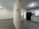 View from living room into kitchen with white cabinets and gray counter tops at 1397 Iron Gate Blvd, Jonesboro, GA 30238