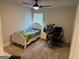 Bright bedroom with a ceiling fan, natural light, and a cozy bed at 1461 Judson Way, Riverdale, GA 30296