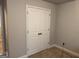Double door closet in a room with neutral walls and carpet at 1461 Judson Way, Riverdale, GA 30296