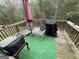 Outdoor deck featuring an umbrella, furniture, and space for entertainment at 1461 Judson Way, Riverdale, GA 30296