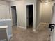 Upstairs hallway showcasing neutral paint and multiple doorways at 1461 Judson Way, Riverdale, GA 30296