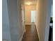 Hallway with hard surface flooring and white trim at 1461 Judson Way, Riverdale, GA 30296