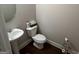Charming powder room featuring a pedestal sink and a toilet at 1461 Judson Way, Riverdale, GA 30296