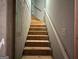 Unfinished staircase leading to a higher floor with neutral walls at 1461 Judson Way, Riverdale, GA 30296