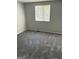 A bedroom featuring new carpet and neutral wall color offering a calming and clean atmosphere at 5575 Marbut Rd, Lithonia, GA 30058