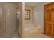 Bathroom featuring a separate tub and shower at 115 Bob White Trl, Fayetteville, GA 30215