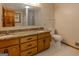 Bathroom features double vanity with granite countertops at 115 Bob White Trl, Fayetteville, GA 30215