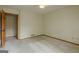 Neutral carpeted bedroom featuring a ceiling fan and a view of an open doorway at 115 Bob White Trl, Fayetteville, GA 30215
