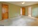Large bedroom with ceiling fan, neutral walls, and soft carpet at 115 Bob White Trl, Fayetteville, GA 30215