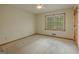 Bedroom featuring neutral walls and carpet with a window providing natural light at 115 Bob White Trl, Fayetteville, GA 30215