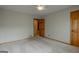 Spacious bedroom with neutral walls and carpet at 115 Bob White Trl, Fayetteville, GA 30215