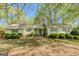 Lovely single-story home with manicured lawn and professional landscaping for great curb appeal at 115 Bob White Trl, Fayetteville, GA 30215