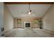 Bright living room features vaulted ceilings, a cozy fireplace and an abundance of natural light at 115 Bob White Trl, Fayetteville, GA 30215