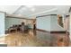 Spacious finished basement featuring a wet bar, leather sectional and stained concrete floors at 217 Brunswick Dr, Tyrone, GA 30290