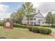 Elegant clubhouse with classic architectural details, lush landscaping, and a welcoming entrance at 217 Brunswick Dr, Tyrone, GA 30290