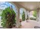 Charming covered porch featuring brick flooring, stately columns, and well-placed greenery at 217 Brunswick Dr, Tyrone, GA 30290