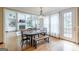 Bright dining room with a wood table and chairs with view of the living room fireplace at 217 Brunswick Dr, Tyrone, GA 30290