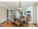 Open-concept dining room next to the fireplace and a staircase, perfect for entertaining at 217 Brunswick Dr, Tyrone, GA 30290
