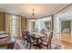 Dining area filled with natural light, adjoining formal living spaces at 217 Brunswick Dr, Tyrone, GA 30290