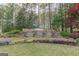 Stone entrance waterfall feature and landscaping at 217 Brunswick Dr, Tyrone, GA 30290