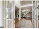 Open foyer with hardwood floors, staircase, and large windows offers a grand entrance at 217 Brunswick Dr, Tyrone, GA 30290